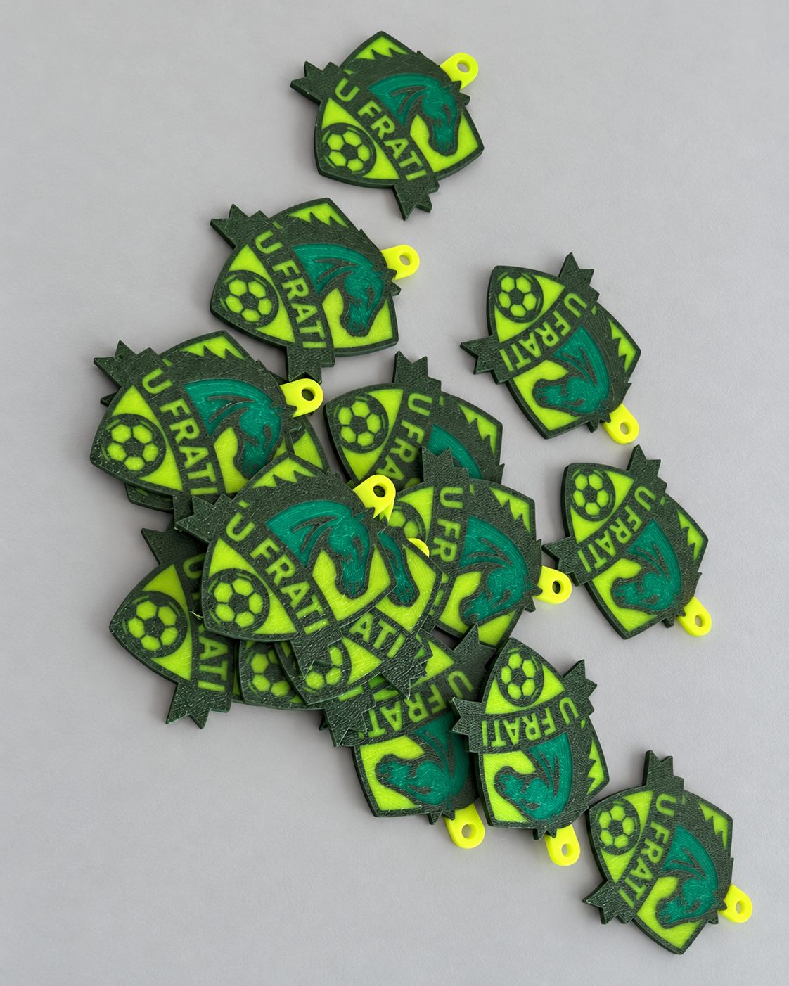 Lotto di portachiavi con stemma U Frati verde e giallo